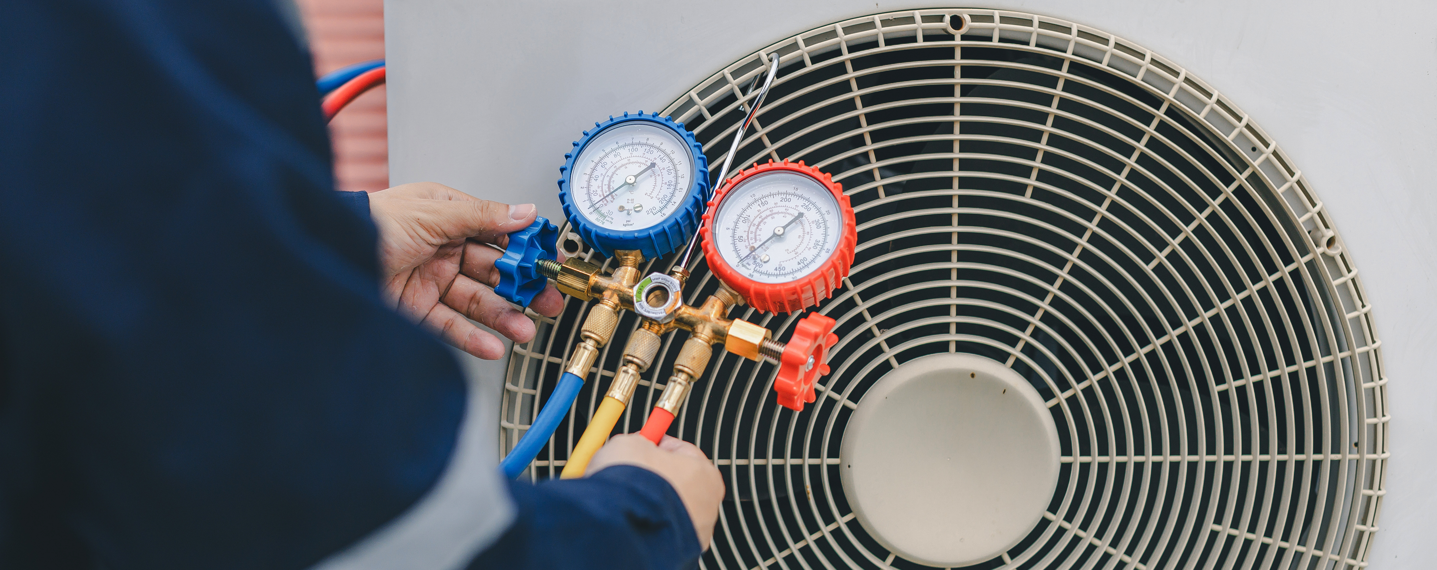 AC repair service in alexandria va. Technician is checking air conditioner. 