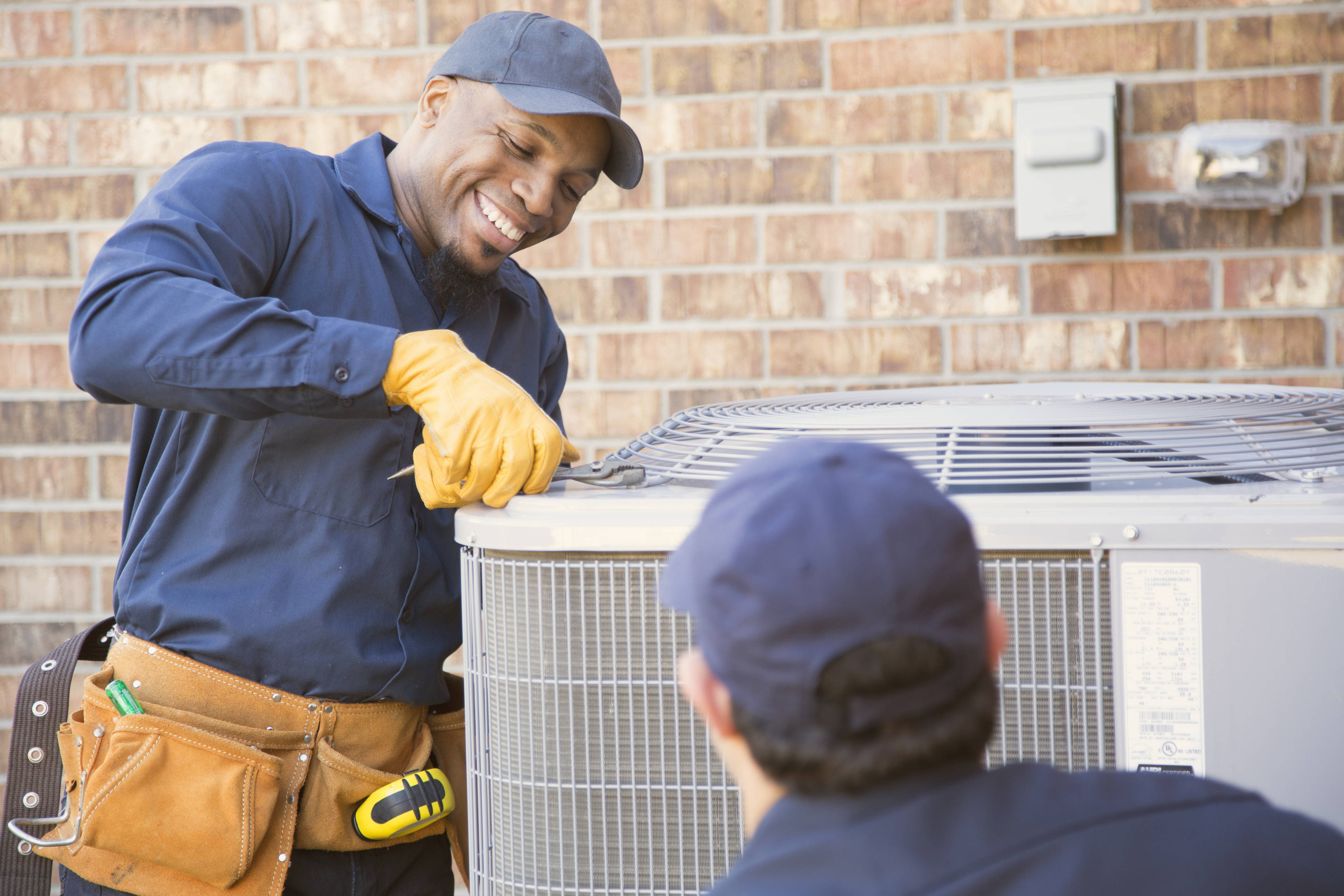 Multi-ethnic team of blue collar ac services from mccarthy services