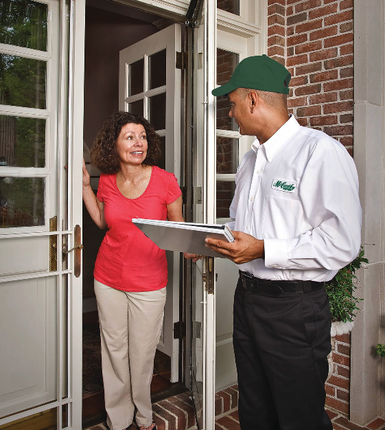 Mccarthy services serviceman talking to a residential home service client.